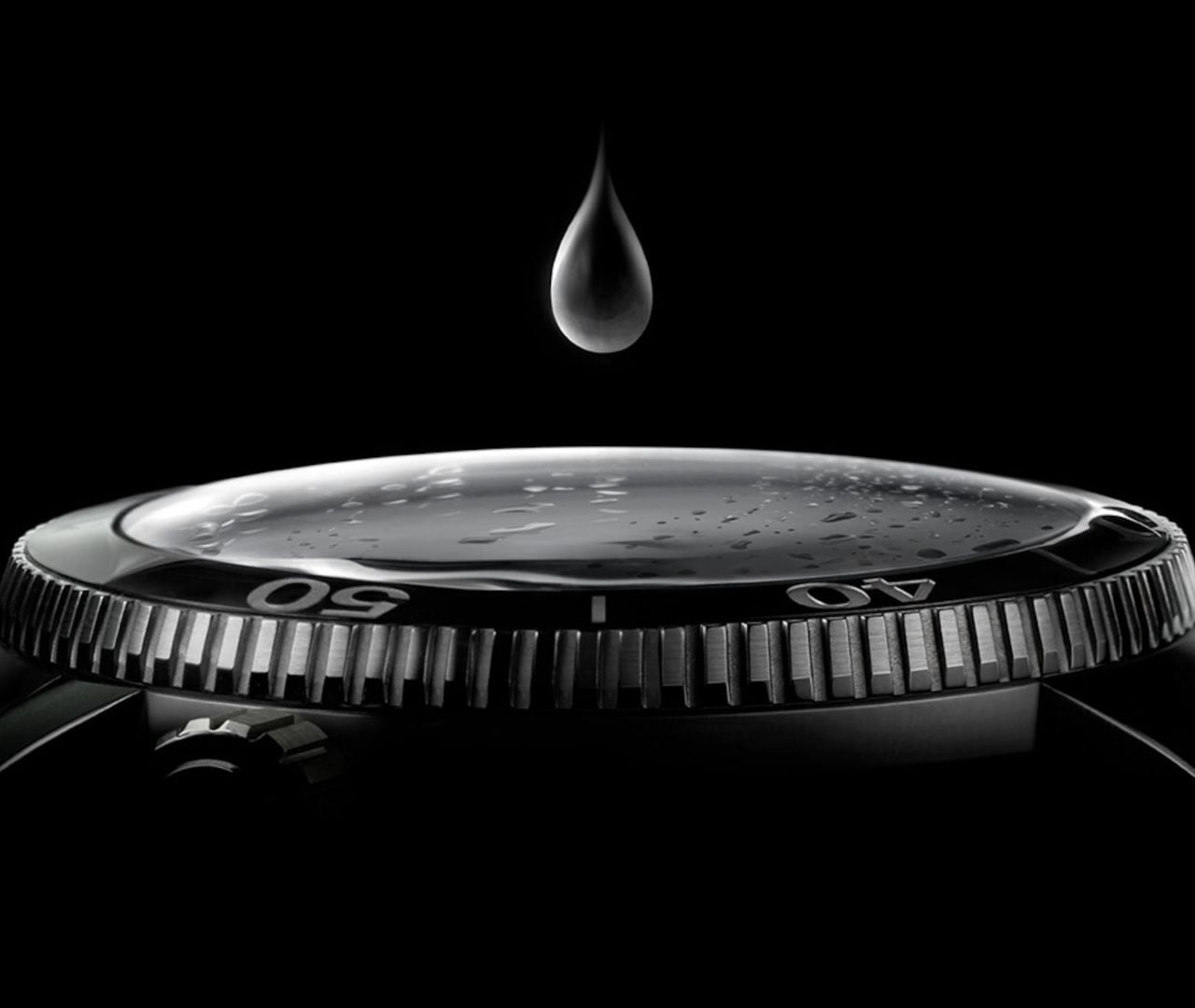 Tissot water-resistance photograph showing a water droplet above a watch crystal